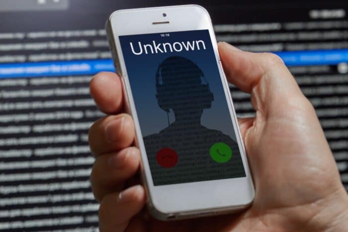 unknown unwanted call to a mobile phone on a dark background