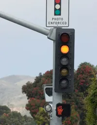 red light camera ticket settlement