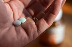 man taking pills