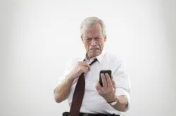 Man reacting in disgust to his mobile