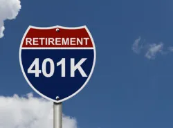An American road interstate sign with words Retirement and 401k with sky, Your 40k1 Retirement Fund