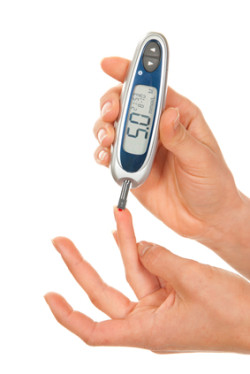Dependent first type Diabetes patient measuring glucose level blood test using ultra mini glucometer and small drop of blood from finger and test strips isolated on a white background