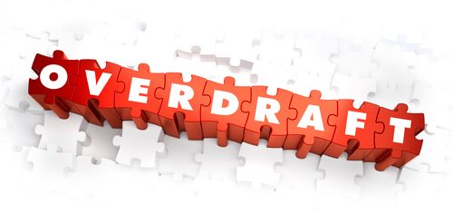 Overdraft - White Word on Red Puzzles on White Background. 3D Render.