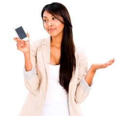Woman by the phone waiting for a call - isolated over white background