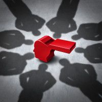 Intimidation of whistleblower concept and whistle blower stress symbol representing the pressure experienced for exposing corruption with shadows of people who do not follw the rules as a red whistle shaped as a human head.
