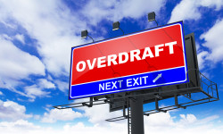 Overdraft - Red Billboard on Sky Background. Business Concept.