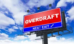 Overdraft - Red Billboard on Sky Background. Business Concept.