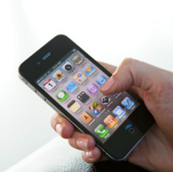iPhone user holding smartphone