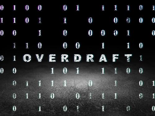 Business concept: Glowing text Overdraft in grunge dark room with Dirty Floor, black background with Binary Code