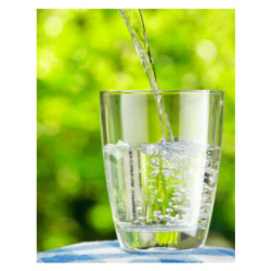 water pouring into glass green background
