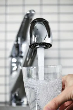 drinking water pouring from faucet