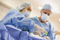 Surgeons Operating On Patient
