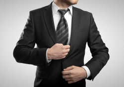 businessman in suit on gray background
