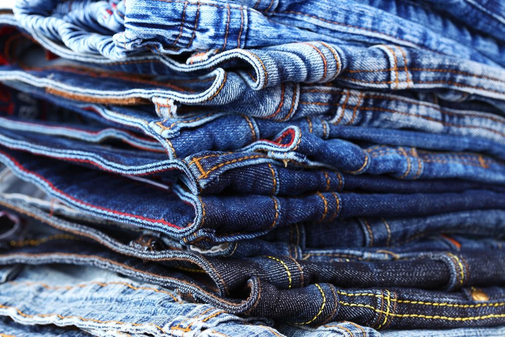Stack of different jeans - detail