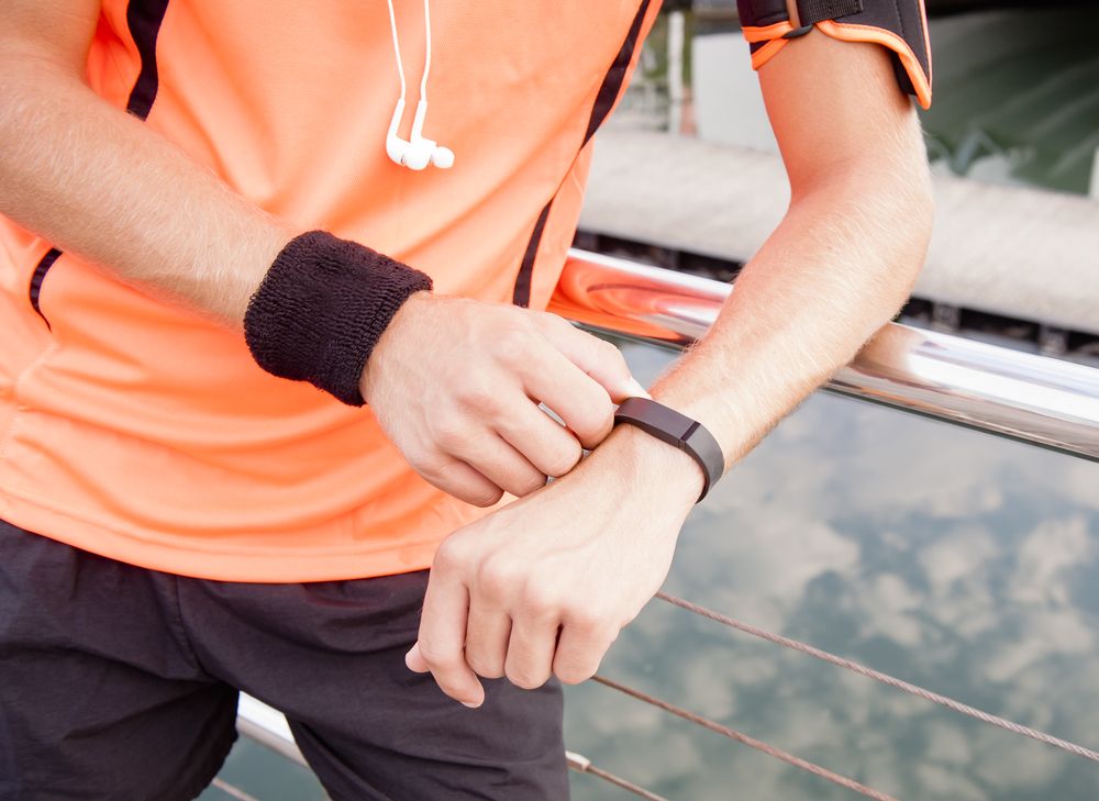 man-using-fitbit