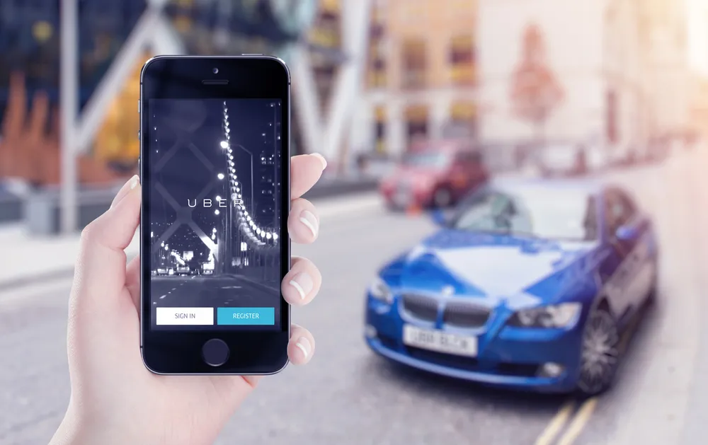 Uber application startup page on the Apple iPhone 5s display in