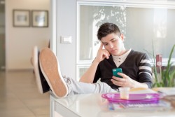 man staring at phone