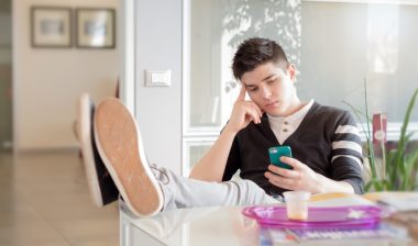 man staring at phone