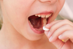 kid-taking-pill