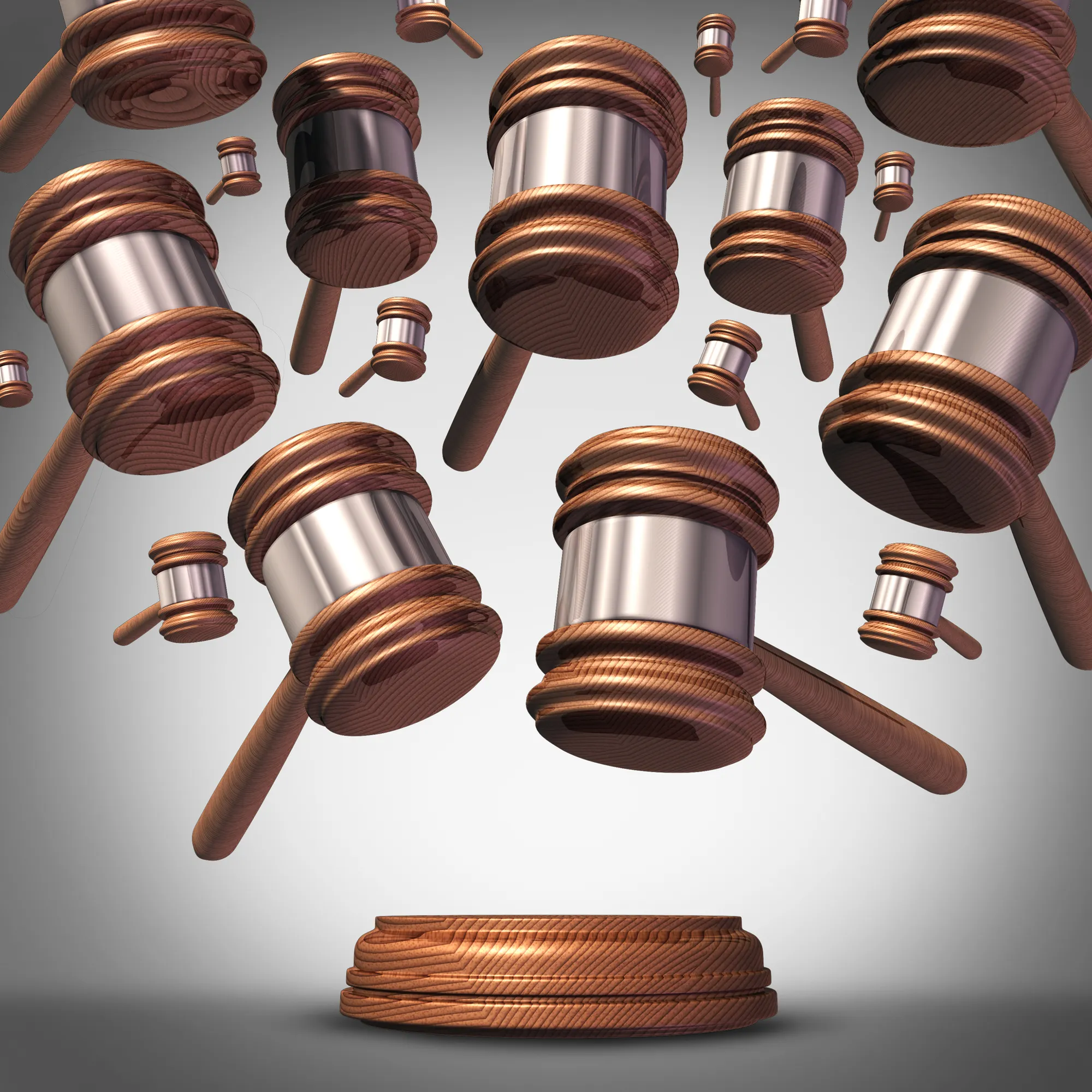 Graphic of gavels falling against a grey background - type class action lawsuit