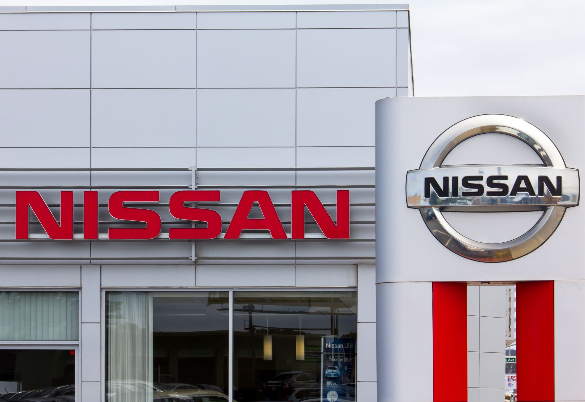 Nissan Motors automobile dealership and sign.