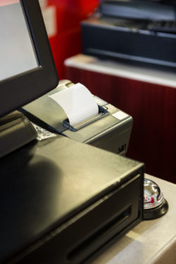 Machine printing receipt at supermarket