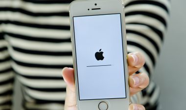 woman holding an apple iphone