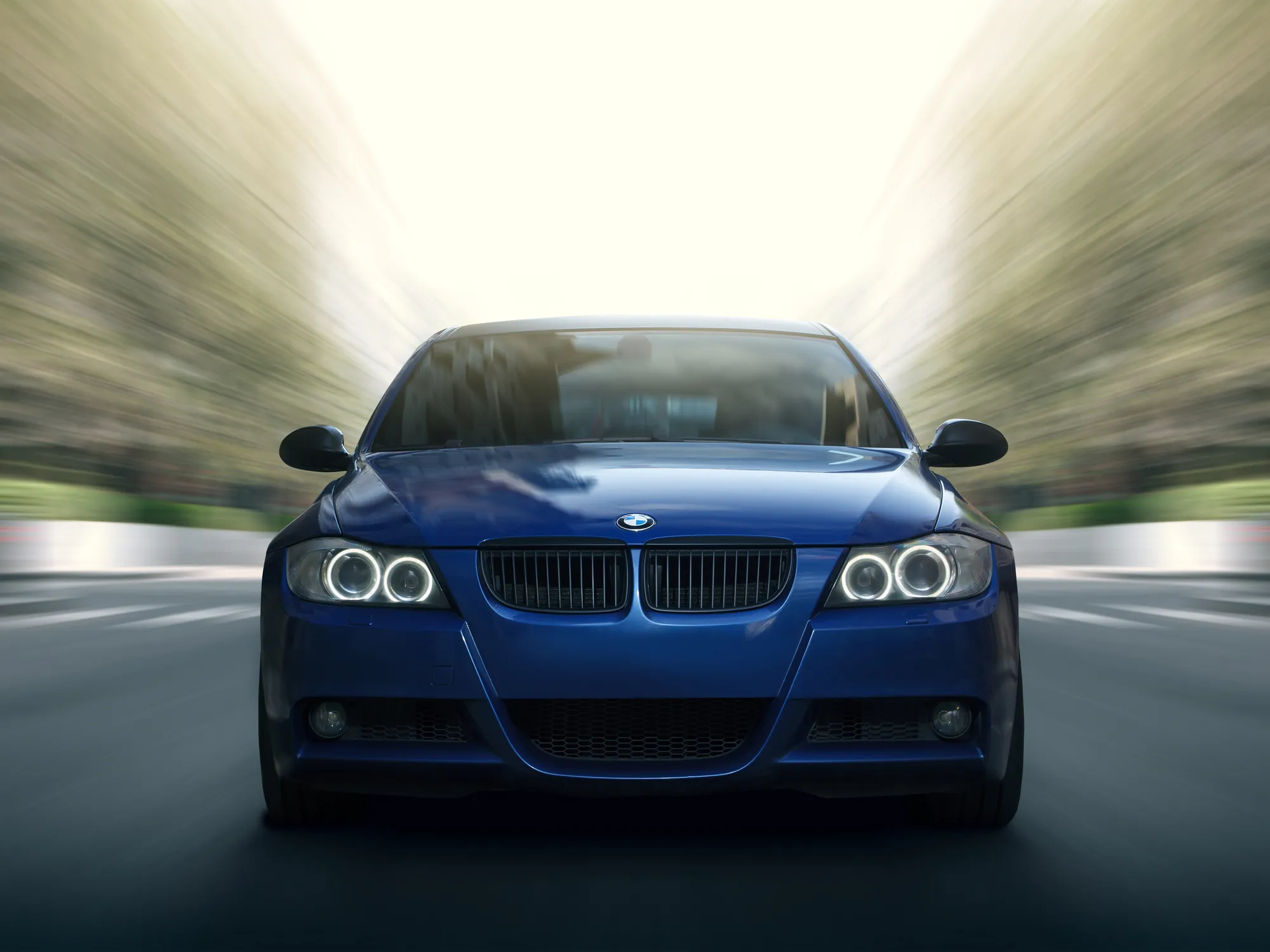 Moscow, Russia - May 10, 2015: Blue car BMW 5 series E90/E91 Fast speed drive on city road