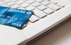 Debit card of Chase Bank on an Apple MacBook White keyboard