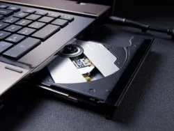 Open optical disc drive on a modern laptop computer without disc.