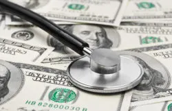 Stethoscope on money background - medical concept