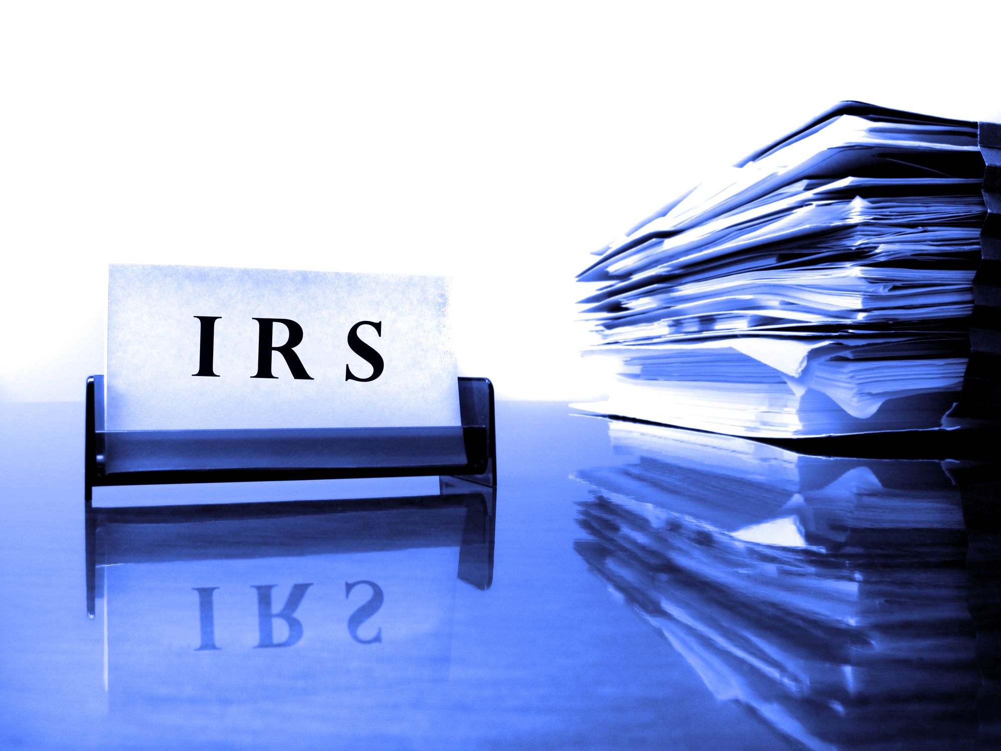 IRS Card on desck with tax files