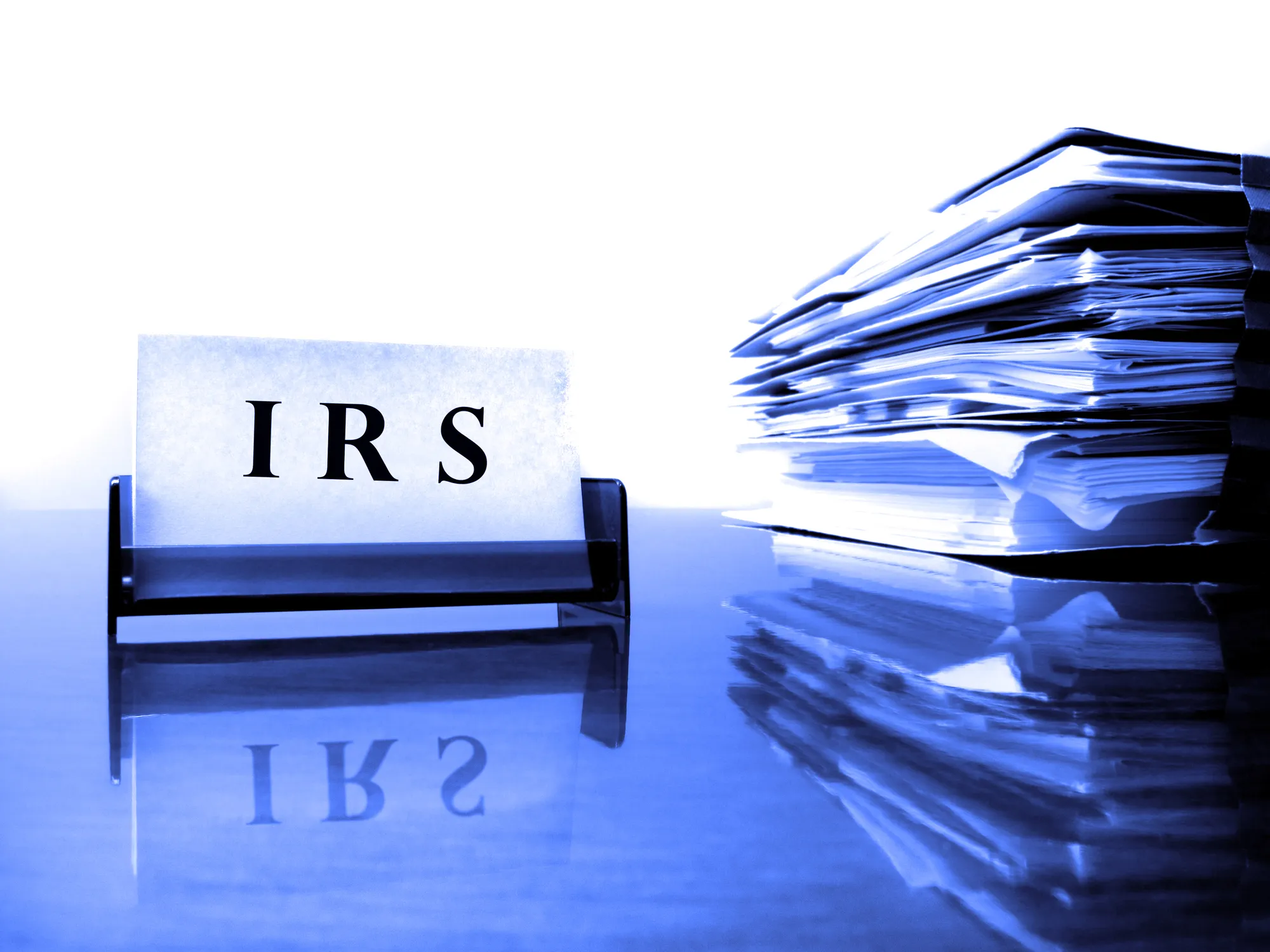 IRS Card on desck with tax files