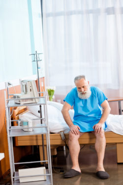 asbestos mesothelioma man hospital bed