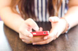 cell phone in hands, TCPA