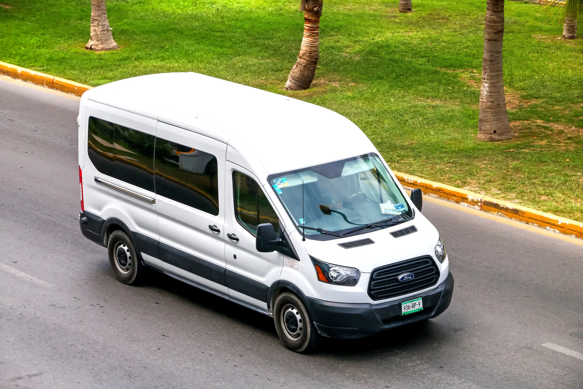 CANCUN, MEXICO - JUNE 3, 2017: White van Ford Transit in the city street.