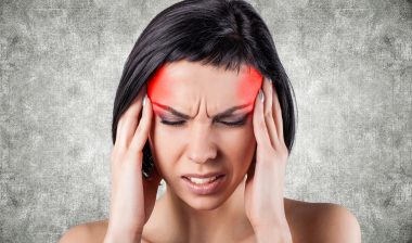 woman with headache, mirena