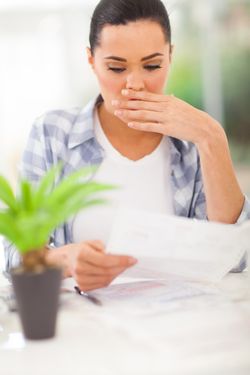 overdraft fees woman shocked by bank statement