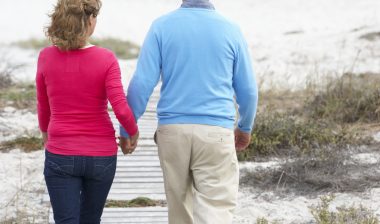 DePuy hip replacement hip implant couple walking beach