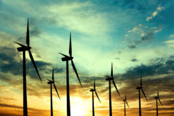 ESCO deregulated utility Wind turbines farm at sunset