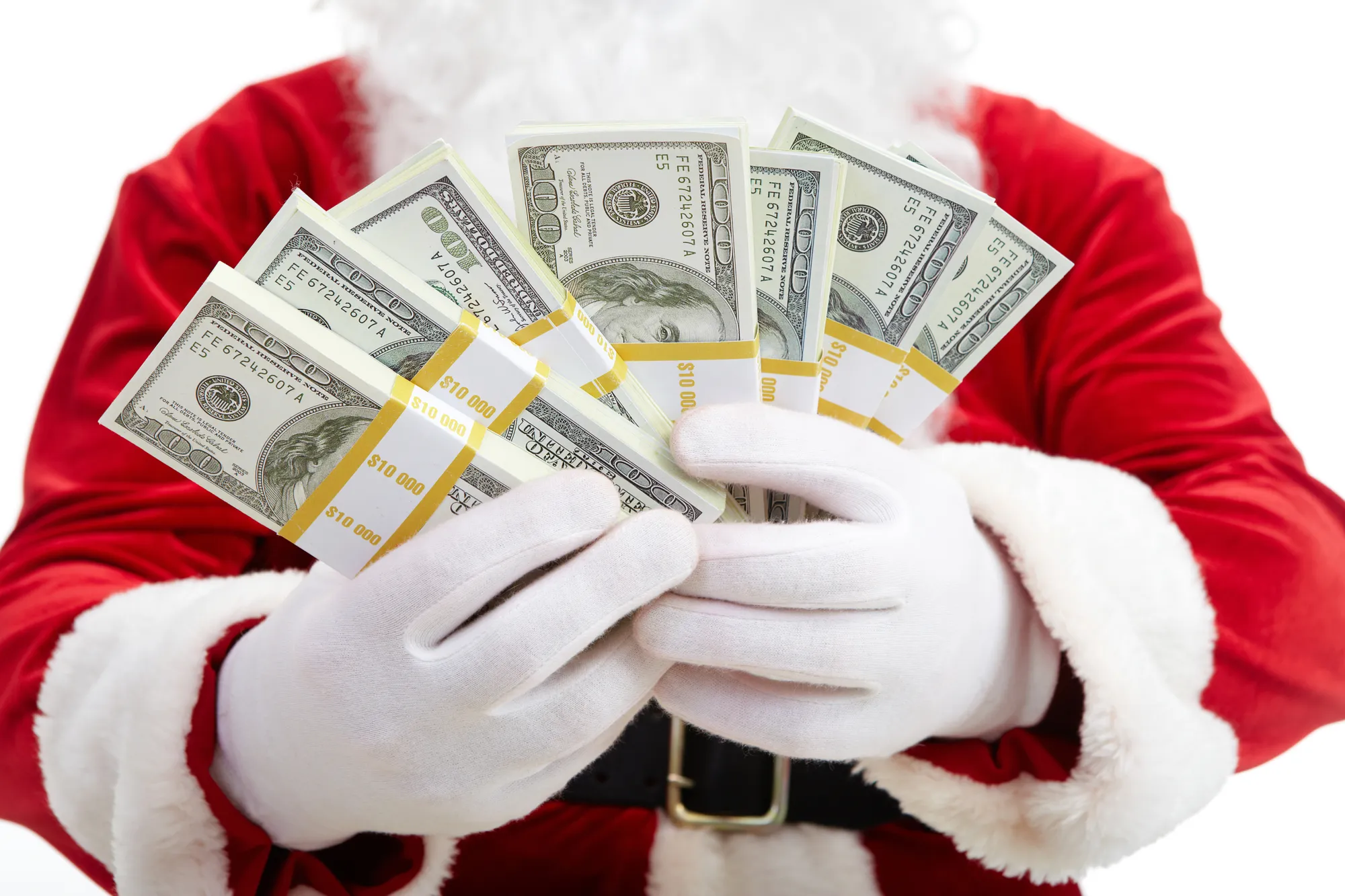 Close-up of Santa&rsquo;s hands with stacks of dollar banknotes