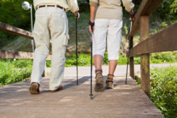 hip implant hip replacement couple walking on bridge