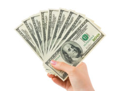 Hand with money isolated on white background