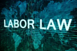 Labor law text concept on green digital world map background
