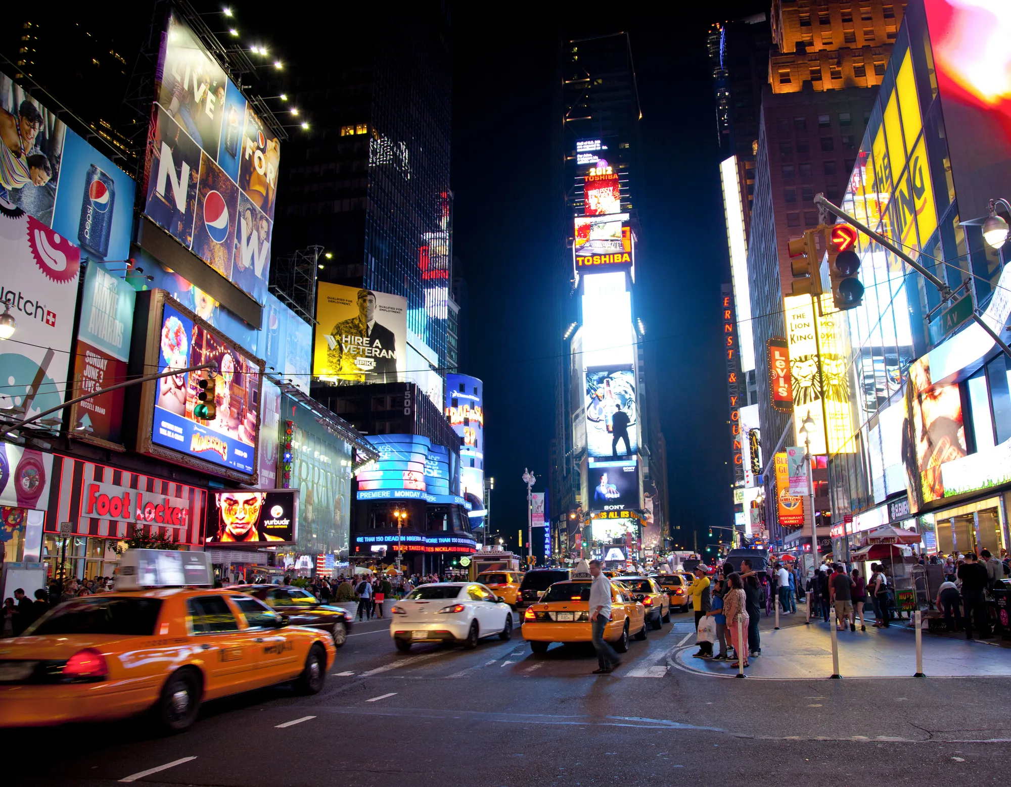 NEW YORK CITY - JUNE 3: Times Square, famous tourist attraction featured with Broadway Theaters and famous restaurant and store locations in New York City, June 3, 2012 in Manhattan, New York City.
