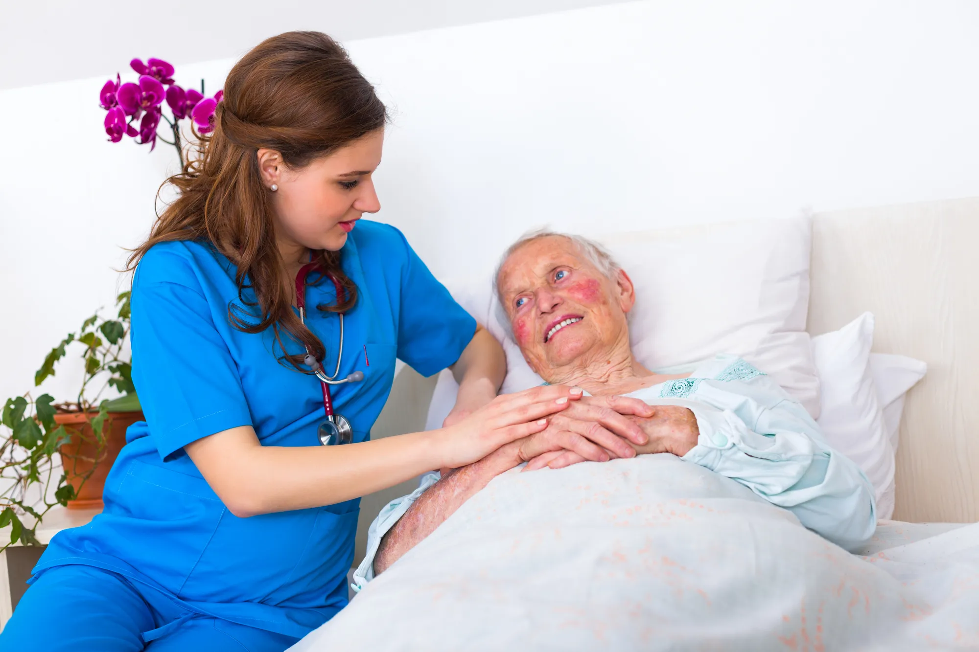 woman hospital bed with nurse