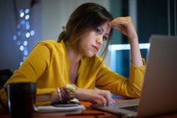 Intel processor defects Spectre Meltdown woman laptop