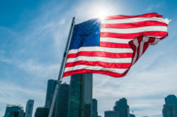 American flag against bright blue sky