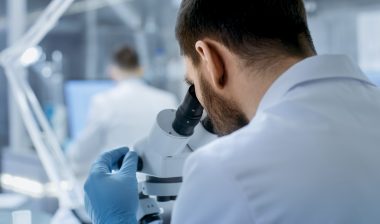 researcher with microscope