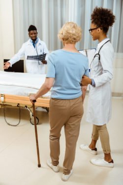 woman with cane, hip replacement